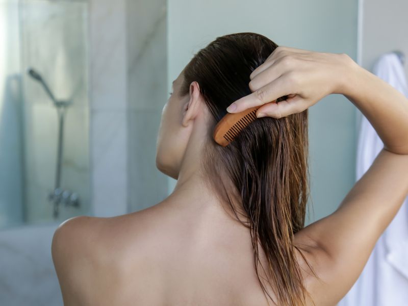 A woman combing her hair