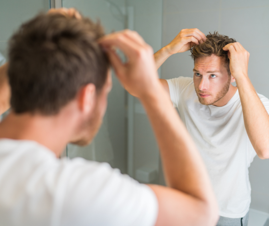 A man doing a hair style